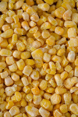 frozen sweet corn on woode surface