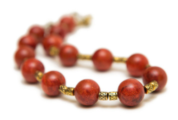 Nice necklace with red beads isolated on white background