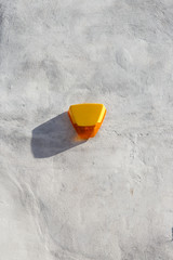 Yellow burglar alarm box set on a white wall, UK.