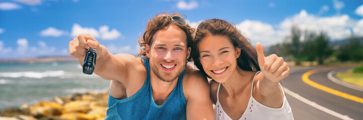 Road trip travel couple banner showing car keys on summer vacation. Happy young people adventure lifestyle. Carsharing, rideshare, autostop young adults buying new car, rental insurance young people.