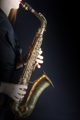 Obraz na płótnie Canvas Saxophone Player Saxophonist playing jazz music