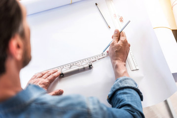 Busy man creating new sketch