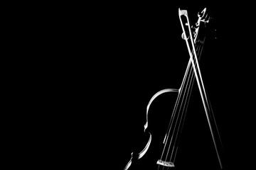 Violin with bow isolated on black