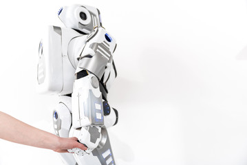 Creature of robotics taking earthborn hand