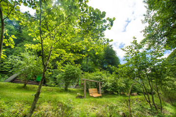 Wooden bench in front of cottage nature house	