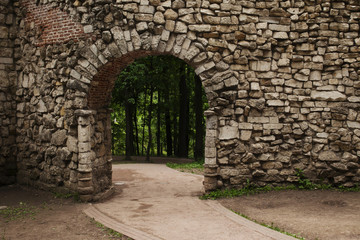 Location from the arch and stone wall, paths and forests in the background