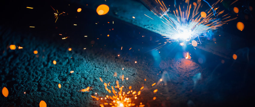 abstract welding sparks light, industrial background