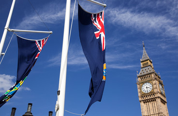 england flags in the wind in front of Big Ben, London, UK