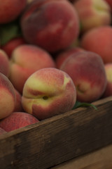 Organic Peaches in a Wooden Crate