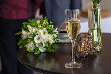 Wedding flowers and glasses of champagne