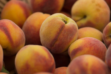 Fototapeta na wymiar Organic Peaches at a Farmers' Market