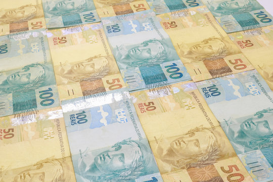 Brazilian money background. Bills called Real, different values. Economy of Brazil concept image.