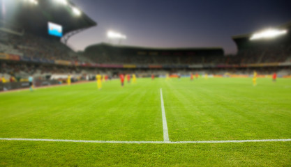 Fototapeta na wymiar evening stadium arena soccer field defocused background