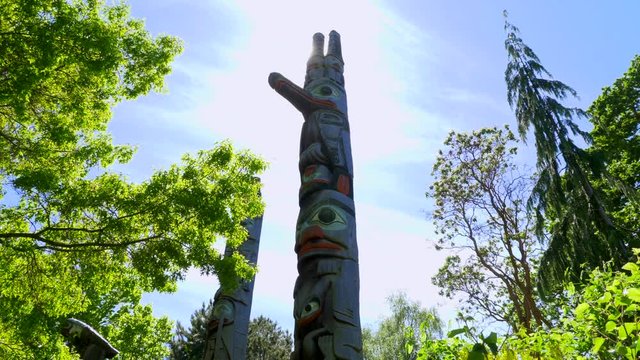 4K Tall First Nations Totem Poles, Wide Angle Sunlight, Indian Art