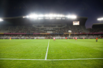 Obraz na płótnie Canvas evening stadium arena soccer field defocused background