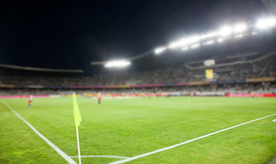 Obraz na płótnie Canvas evening stadium arena soccer field defocused background