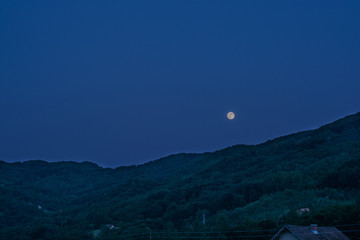 Full moon and mountains panorama real