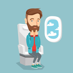 Young man suffering from fear of flying.