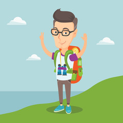 Backpacker with his hands up enjoying the scenery.