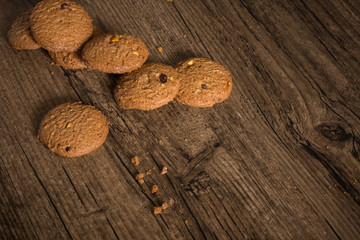Obraz na płótnie Canvas Delicious coffee cookie with copy space on wooden background.