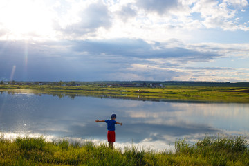 Lone child over the lake