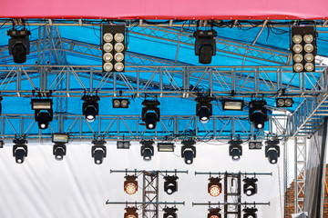 professional spotlight system mounted under roof of outdoor stage