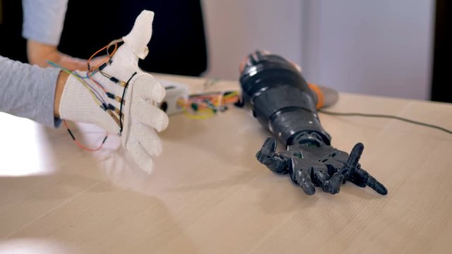 Bionic arm is making some movements. Artificial arm mechanism is being tested. 4K.