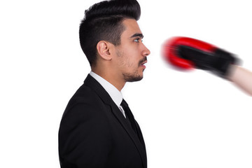Naklejka premium Businessman in suit gets hit, business agression