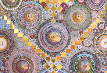Circular ceramic pattern background on wall in Wat Phasornkaew in Phetchabun, Thailand.