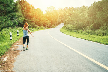 Obraz premium Women exercise on the street. Nature park. Asian women