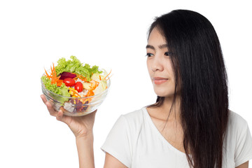 Portrait of  beautiful asian young  woman eating vegetable salad Isolated on white background.