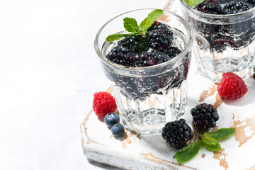 carbonated drinks with berries on white background