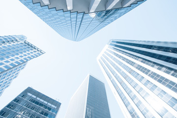 Obraz na płótnie Canvas View of modern blue colored contemporary office city buildings 