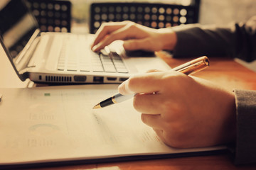 Administrator business man financial inspector and secretary making report, calculating or checking balance.