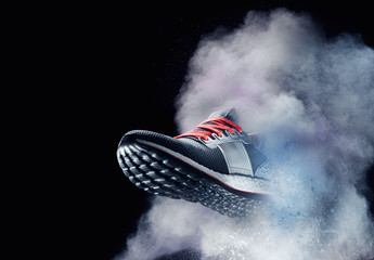 close up view of nice sport shoe is getting out of dusty cloud  - 160748649