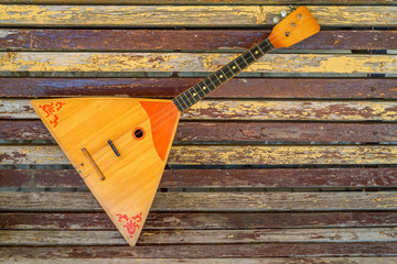 Musical instrument balalaika on wooden background