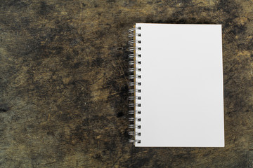 brown blank notebook on wooden background