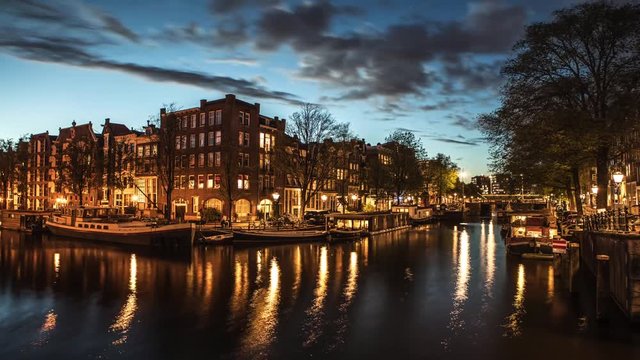The most famous canals and embankments of Amsterdam. General view of the cityscape and traditional Netherlands architecture. 4K Time Lapse Footage.