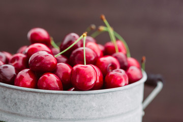 Fresh red cherries in bucket