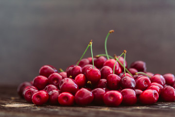 Fresh red cherries on wood