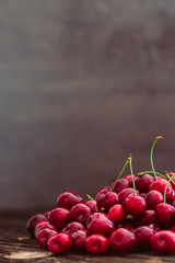 Fresh red cherries on wood