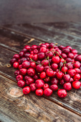 Fresh red cherries on wood