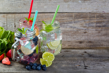 Selection of colorful mojitoes in jars