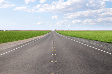 panoramic  view of nice summer empty road  through the valley