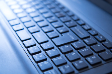 Modern laptop keyboard in the sunlight
