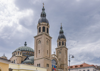 Detail of the Holy Trinity Metropolitan Cathedral in Sibiu, Romania, against a dramatic sky
