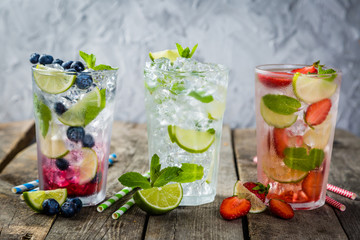 Selection of colorful mojitoes in glasses