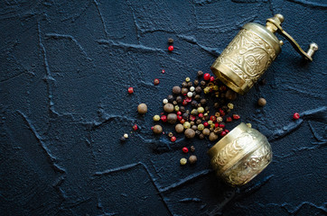 Vintage pepper mill and peppercorns