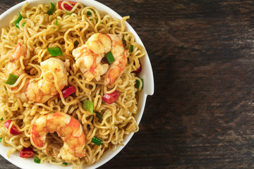 Instant noodles with vegetables, shrimps, and copy space