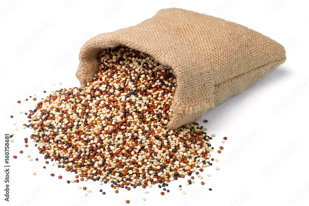 Sticker raw quinoa in the sack, isolated on white background, (large depth of field, taken with tilt shift lens)